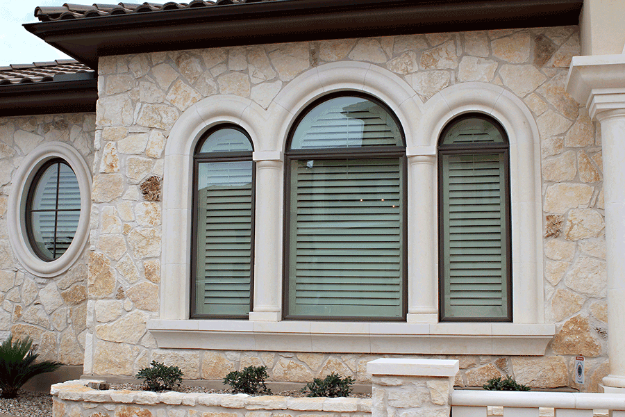 Exterior view of plantation shutters on the inside of a San Antonio home.