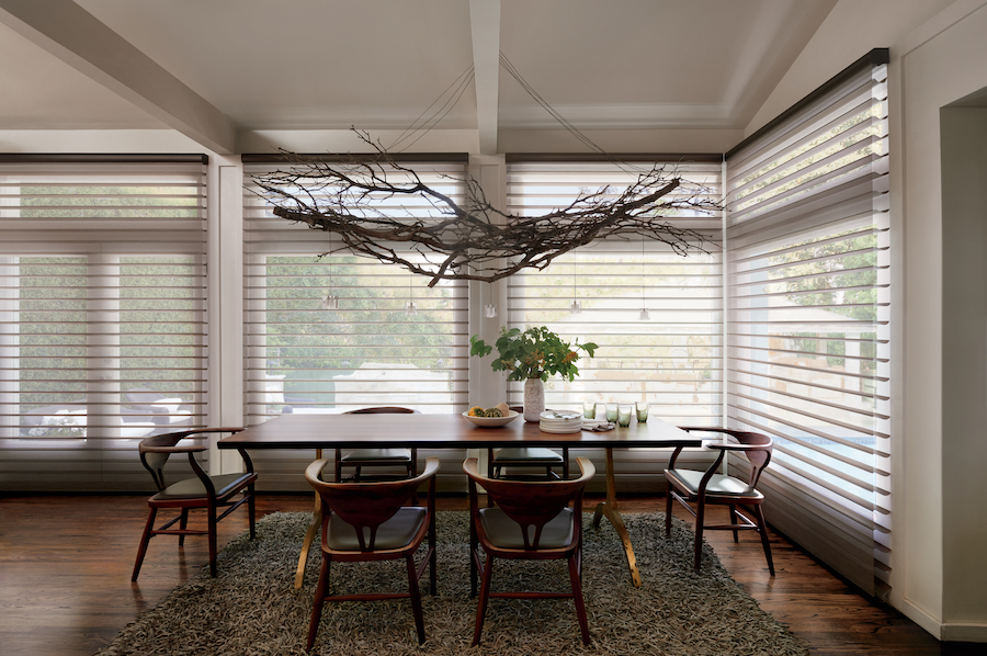 Sheer window treatments on dining room windows.