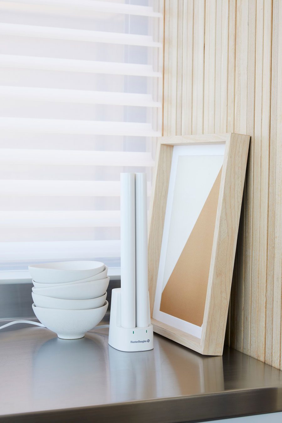 Hunter Douglas rechargeable battery wand in charging dock for PowerView motorized shades