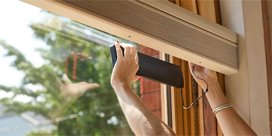 Solar charger in window connected to rechargeable battery wand