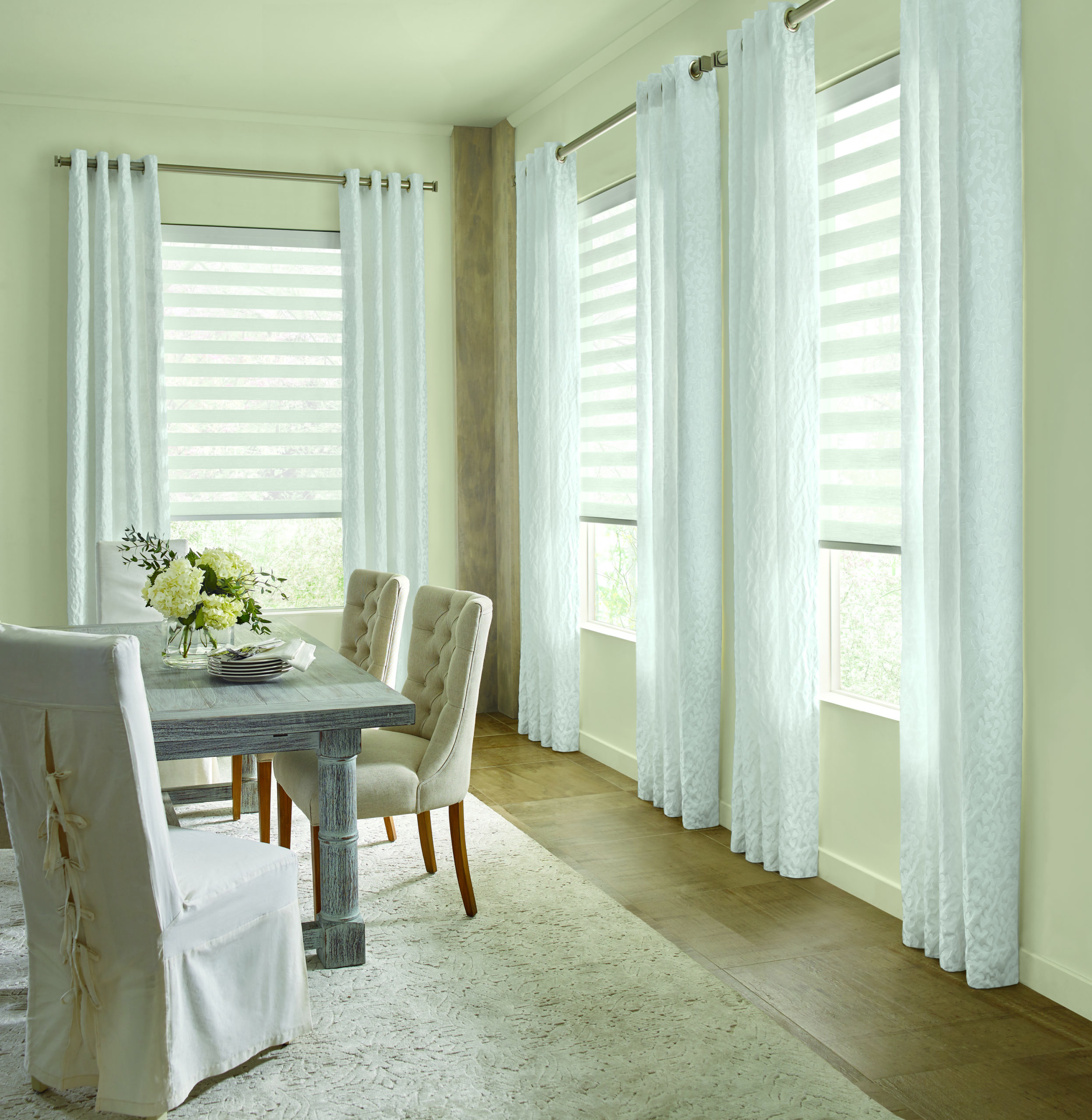 full length neutral drapes frame dining room windows in San Antonio, TX