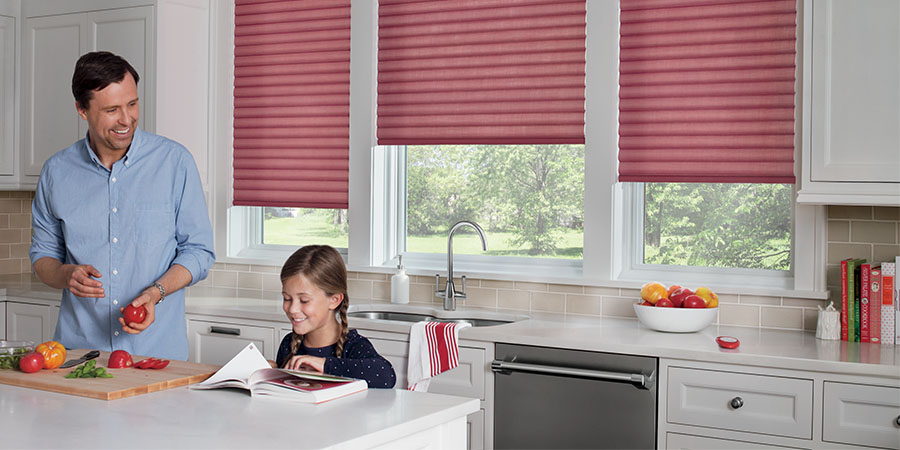 kitchen with red automated cellular roller shades in San Antonio TX