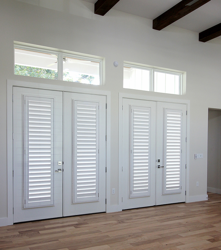 double set of french doors with white custom wood shutters in San Antonio TX