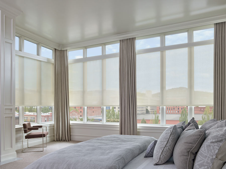 Designer screen shades on floor to ceiling windows