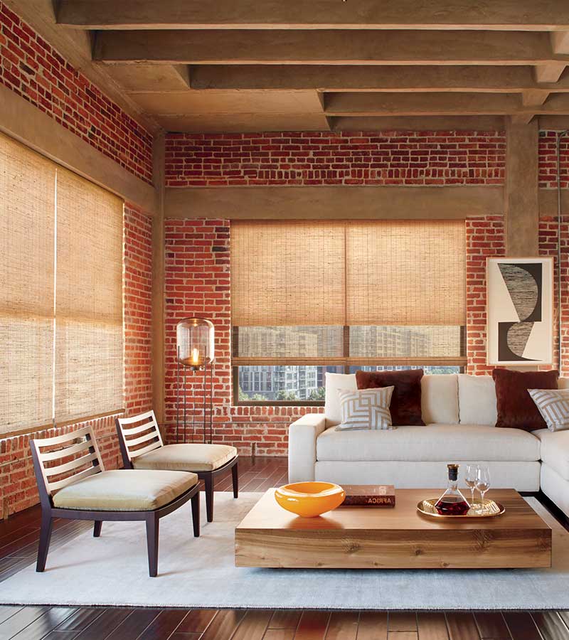 exposed brick loft with woven wooden window shades in San Antonio TX