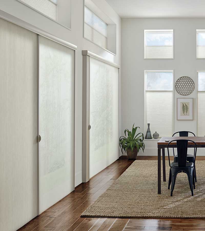 contemporary dining room with sliding glass doors and dual opacity white window shadings