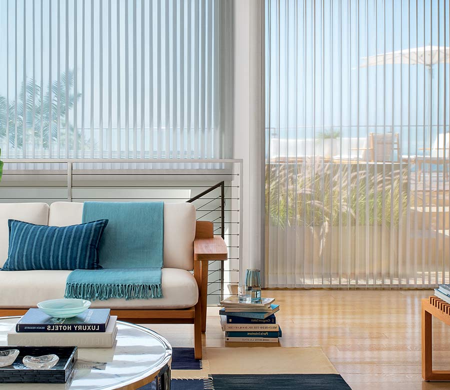 coastal inspired home with floor to ceiling large window shades