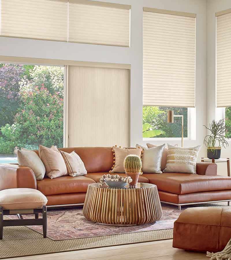 western boho living room with large windows and sliding glass window panels in San Antonio, TX