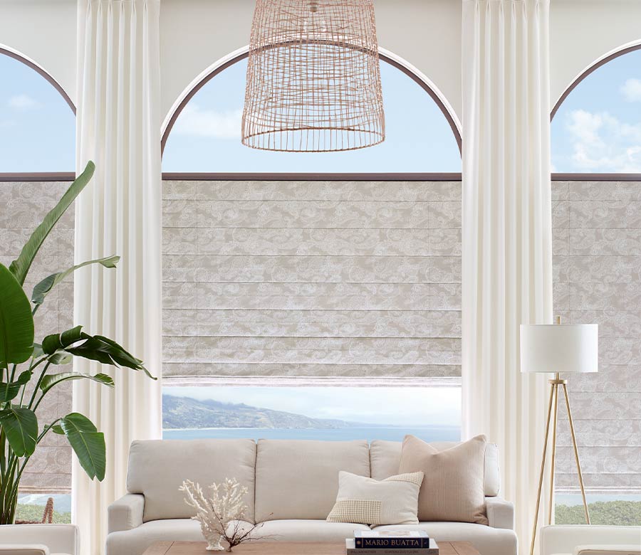 floor to ceiling arched windows in modern neutral living room San Antonio, TX