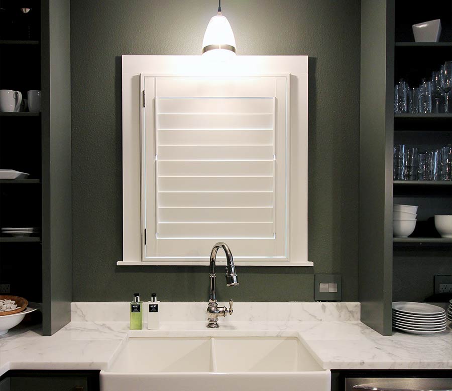 green kitchen sink white shutters in San Antonio, TX