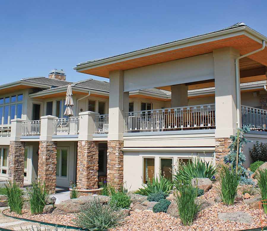 Cream colored exterior roller solar shades in San Antonio, TX