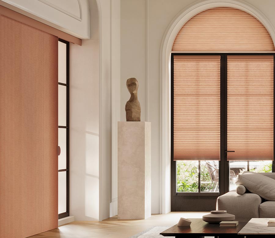 living room with peach vertical cellular shades duette vertiglide san antonio