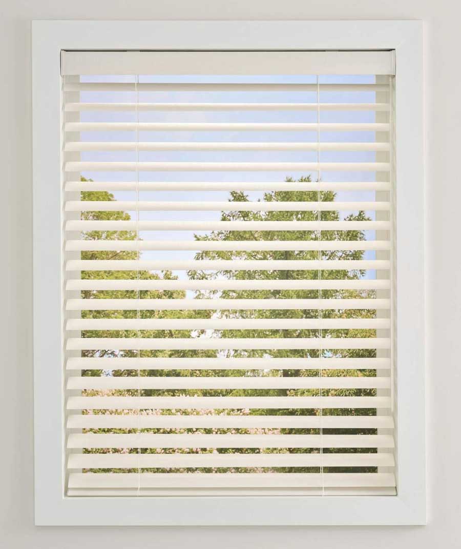 view through slats of the aria soft blinds in white on window frame