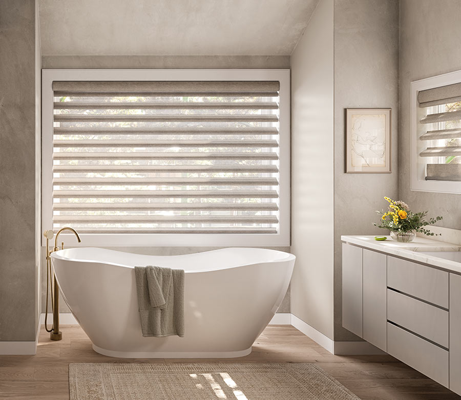 pirouette-window-treatments-primary-bathroom-suite-hunter-douglas-window-fashions-of-texas bathroom with tub and pirouette window treatments