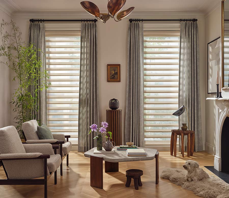pirouette-window-treatments-sheer-curtains-layered-look-living-room-hunter-douglas-window-fashions-of-texas Pirouette window shades with curtains in living room during daylight