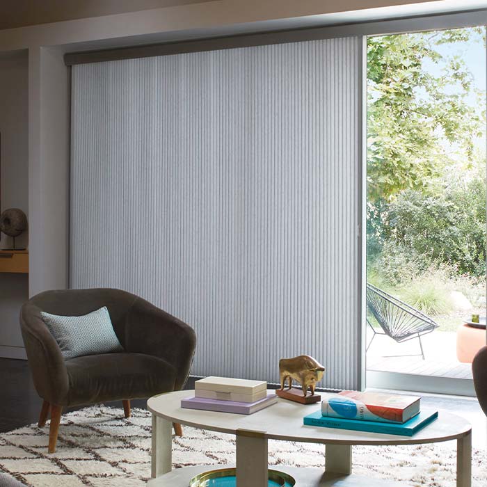 duette-vertiglide-vertical-window-coverings-hunter-douglas-window-fashions-of-texas vertical cellular shades on sliding glass doors improving energy efficiency in Texas home