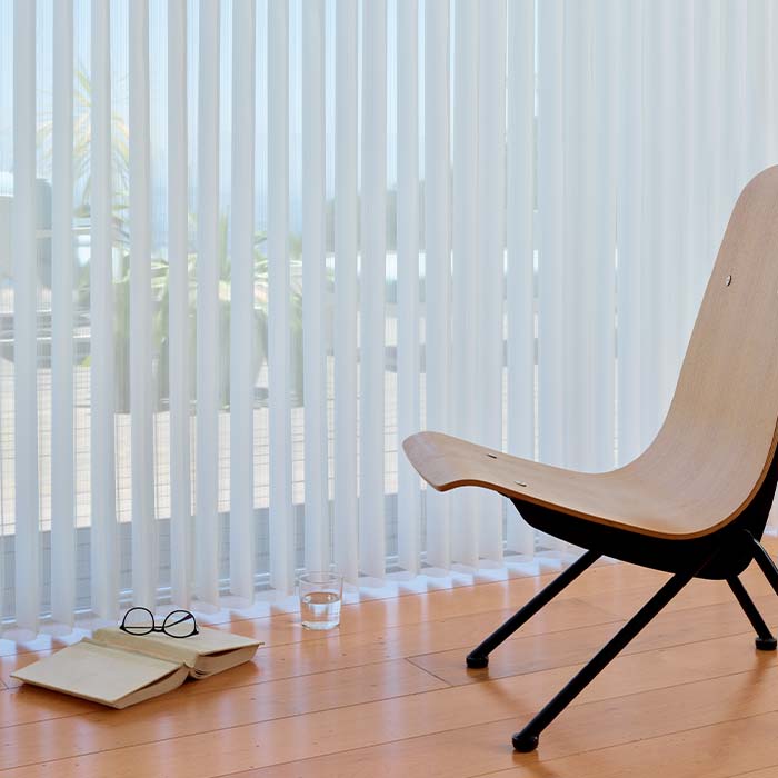 luminette-vertical-window-coverings-hunter-douglas-window-fashions-of-texas Luminette privacy sheers diffusing natural light across large patio doors