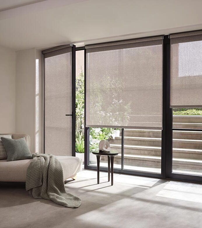 sheer-grey-designer-screen-shades-with-handle-window-fashions-of-texas living room with patio glass doors with screen shades