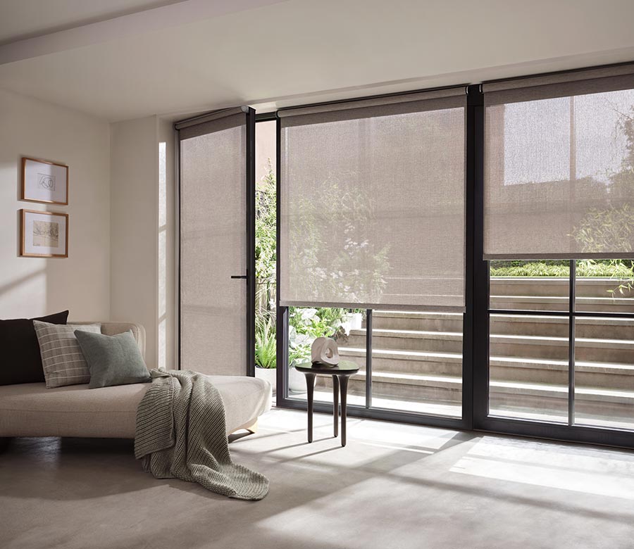 living room with patio glass doors with screen shades