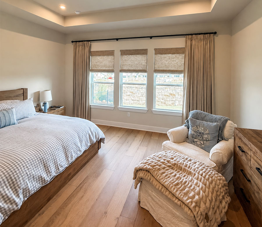 Provenance® Woven Wood Shades with Custom Drapery for light control and privacy in a San Antonio bedroom